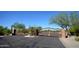 Community entrance with an ornate gate and desert landscaping at 4439 E Coyote Wash Dr, Cave Creek, AZ 85331