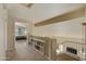 Bright upstairs hallway showcasing book shelves and bedroom with vaulted ceilings at 4439 E Coyote Wash Dr, Cave Creek, AZ 85331