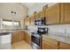 Well-lit kitchen featuring stainless steel appliances and granite countertops at 4439 E Coyote Wash Dr, Cave Creek, AZ 85331