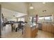 An open concept kitchen and dining area with a granite island and stainless steel appliances at 4439 E Coyote Wash Dr, Cave Creek, AZ 85331