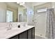 Bright bathroom featuring a double sink vanity, modern finishes, and shower at 454 N 19Th Pl, Coolidge, AZ 85128