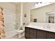 Bathroom featuring tub/shower combo, neutral tones and modern vanity at 454 N 19Th Pl, Coolidge, AZ 85128