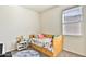 Well-lit bedroom with bright decor, a comfortable bed, and natural light at 454 N 19Th Pl, Coolidge, AZ 85128