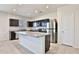 Modern kitchen featuring granite countertops, stainless steel appliances, and a central island at 454 N 19Th Pl, Coolidge, AZ 85128