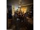 Dining room featuring an ornate wooden table, wood floors, and a ceiling fan at 501 S 98Th St, Mesa, AZ 85208