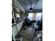 Cozy living room featuring wood floors, ceiling fan, and built-in display cabinetry at 501 S 98Th St, Mesa, AZ 85208