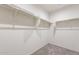 Walk-in closet with custom shelving at 5073 S 251St Dr, Buckeye, AZ 85326