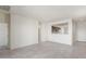 View of kitchen and doorway from spacious open floor plan living room with tile floors at 5073 S 251St Dr, Buckeye, AZ 85326