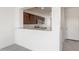 View of granite countertops and stainless appliances through opening to kitchen at 5073 S 251St Dr, Buckeye, AZ 85326