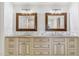 Bathroom vanity with double sinks, granite countertop and framed mirrors at 5201 N 33Rd St, Phoenix, AZ 85018