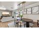 Dining room features modern lighting, open space, and sliding glass doors to the patio at 5201 N 33Rd St, Phoenix, AZ 85018