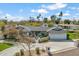 Stunning single-story home with a spacious driveway, 3-car garage, mature landscaping, and a cozy outdoor seating area at 5201 N 33Rd St, Phoenix, AZ 85018