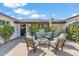 Cozy front porch with comfortable seating around a fire pit, lush greenery, and a welcoming entrance at 5201 N 33Rd St, Phoenix, AZ 85018