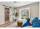 Bright living room with a comfortable blue sofa at 5201 N 33Rd St, Phoenix, AZ 85018