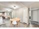 Bright dining area features wood table, seating for four, and a mirrored accent wall at 540 N May -- # 2151, Mesa, AZ 85201