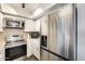 Kitchen with stainless steel appliances, white cabinets, and an electric stove, ready for culinary creations at 540 N May -- # 2151, Mesa, AZ 85201