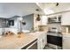 Kitchen featuring stainless steel appliances, white cabinetry, and an island counter with space for seating at 540 N May -- # 2151, Mesa, AZ 85201