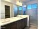 Modern primary bathroom with dual sinks, a large mirror, and walk-in shower at 5893 N Nigal Rd, Casa Grande, AZ 85194