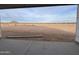 View from the covered patio looking out to a large desert lot at 5893 N Nigal Rd, Casa Grande, AZ 85194