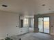 Interior view with drywall installed showing an open floor plan with sliding glass doors at 5893 N Nigal Rd, Casa Grande, AZ 85194