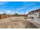 Large backyard with a large tree and some patio space at 5902 W Wolf St, Phoenix, AZ 85033