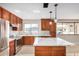 Bright kitchen with island seating and stainless steel appliances at 5902 W Wolf St, Phoenix, AZ 85033