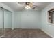 A basic but functional bedroom includes a closet and a small window at 6830 W Mckinley St, Phoenix, AZ 85043