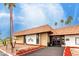 Community clubhouse exterior shows desert landscaping and easy access to resident services at 6830 W Mckinley St, Phoenix, AZ 85043