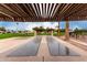 Enjoy a match on the shuffleboard court under the shade of the wooden pergola at 6830 W Mckinley St, Phoenix, AZ 85043