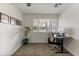 Cozy home office with neutral carpet, a modern desk setup, and natural light at 718 W Vine Ave, Mesa, AZ 85210