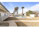 Backyard pool surrounded by desert landscape at 718 W Vine Ave, Mesa, AZ 85210