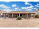 Backyard view featuring patio and gravel area, perfect for relaxing at 7214 W Crest Ln, Glendale, AZ 85310