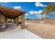 Large backyard with stone landscaping and a covered patio at 7214 W Crest Ln, Glendale, AZ 85310