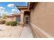 Charming front entry with beautiful desert landscaping and a security screen door at 7214 W Crest Ln, Glendale, AZ 85310