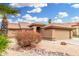 Charming single-story home with desert landscaping and a tiled roof at 7214 W Crest Ln, Glendale, AZ 85310