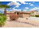 Charming single-story home with desert landscaping and a tiled roof at 7214 W Crest Ln, Glendale, AZ 85310