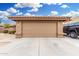 A two car garage with desert landscaping at 7214 W Crest Ln, Glendale, AZ 85310