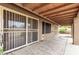 Covered patio with secure sliding glass doors offers a relaxing outdoor living space at 7214 W Crest Ln, Glendale, AZ 85310