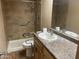 Functional bathroom featuring a shower with safety bars, vanity and large mirror at 723 E Garnet Ave, Mesa, AZ 85204