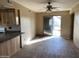 Kitchen area featuring wood cabinets and countertops, complemented by a sliding glass door to the outdoor space at 723 E Garnet Ave, Mesa, AZ 85204