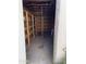 Interior of an outdoor storage shed with wooden walls and shelving at 723 E Garnet Ave, Mesa, AZ 85204