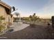 Expansive backyard featuring desert landscaping, a large patio, and views of the surrounding scenery at 8199 E Sweet Acacia Dr, Gold Canyon, AZ 85118