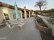 Inviting backyard featuring desert landscaping, outdoor seating, and lush foliage at 8199 E Sweet Acacia Dr, Gold Canyon, AZ 85118