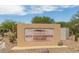 Welcome sign to Mountainbrook Village community with desert landscaping in the background at 8199 E Sweet Acacia Dr, Gold Canyon, AZ 85118