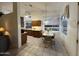 Bright kitchen featuring tile floors, window with natural lighting, and a breakfast table at 8199 E Sweet Acacia Dr, Gold Canyon, AZ 85118