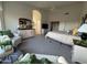 Spacious main bedroom with a large window, seating, and arched entry to ensuite bathroom at 8199 E Sweet Acacia Dr, Gold Canyon, AZ 85118