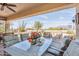 Outdoor patio featuring a dining table and chairs overlooking serene desert scenery and mountains at 8212 E Masters Rd, Gold Canyon, AZ 85118