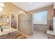 Bright bathroom with a large shower, double sink vanity, and natural light from a window at 8212 E Masters Rd, Gold Canyon, AZ 85118