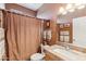 Cozy bathroom features granite counters and a framed mirror above a white sink beside a shower with a brown curtain at 8212 E Masters Rd, Gold Canyon, AZ 85118