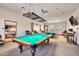 Well-lit billiard room with multiple pool tables and comfortable seating, perfect for recreation at 8212 E Masters Rd, Gold Canyon, AZ 85118